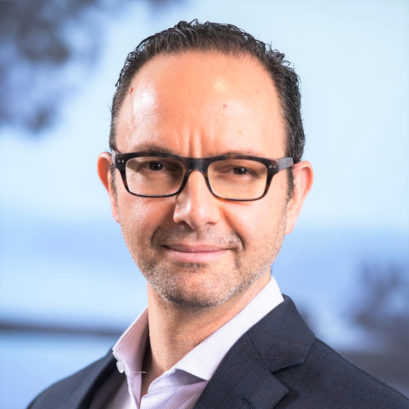 Portrait of Ian Schnoor, Executive Director of the Financial Modeling Institute